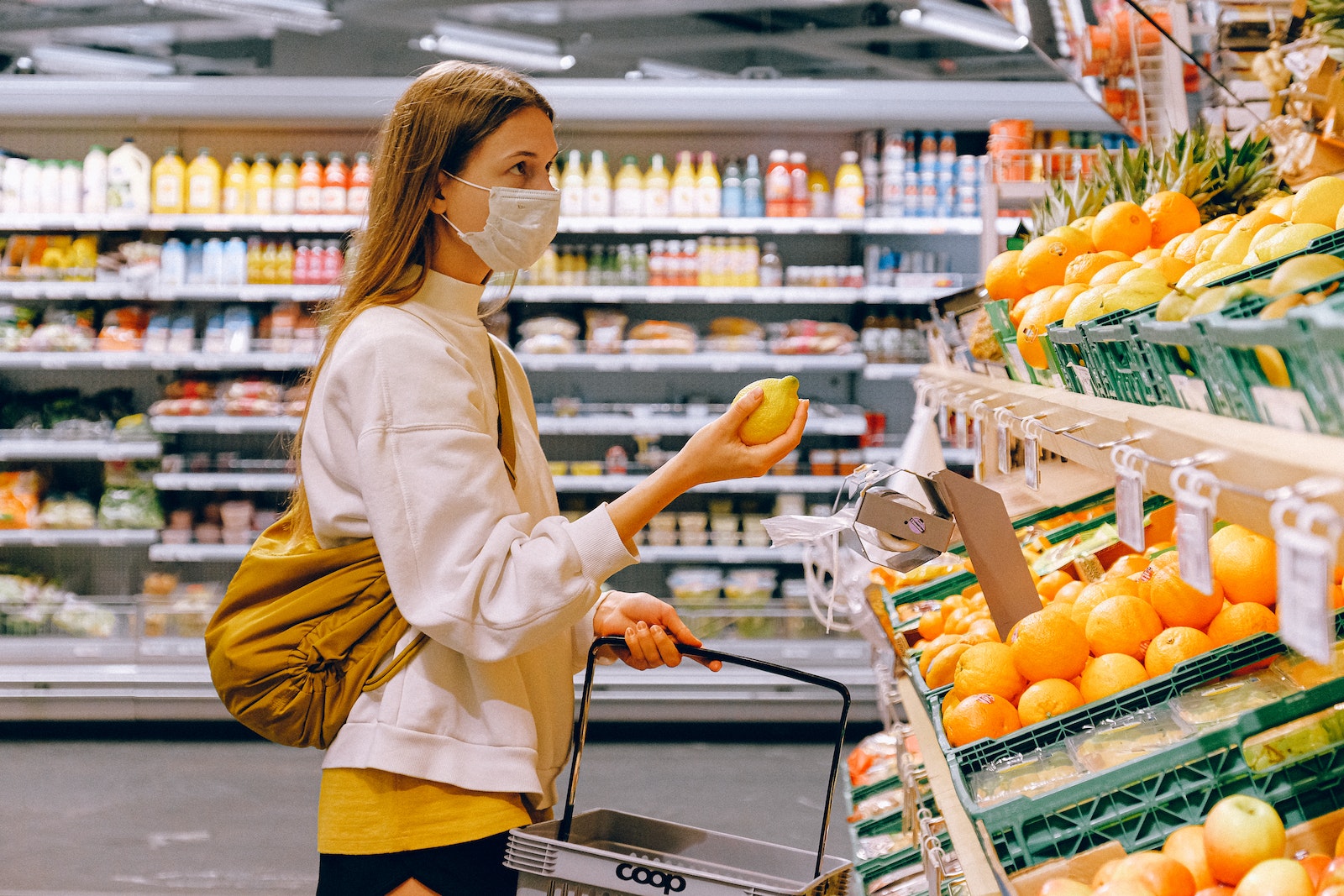 Woman checking fruits in a supermarket