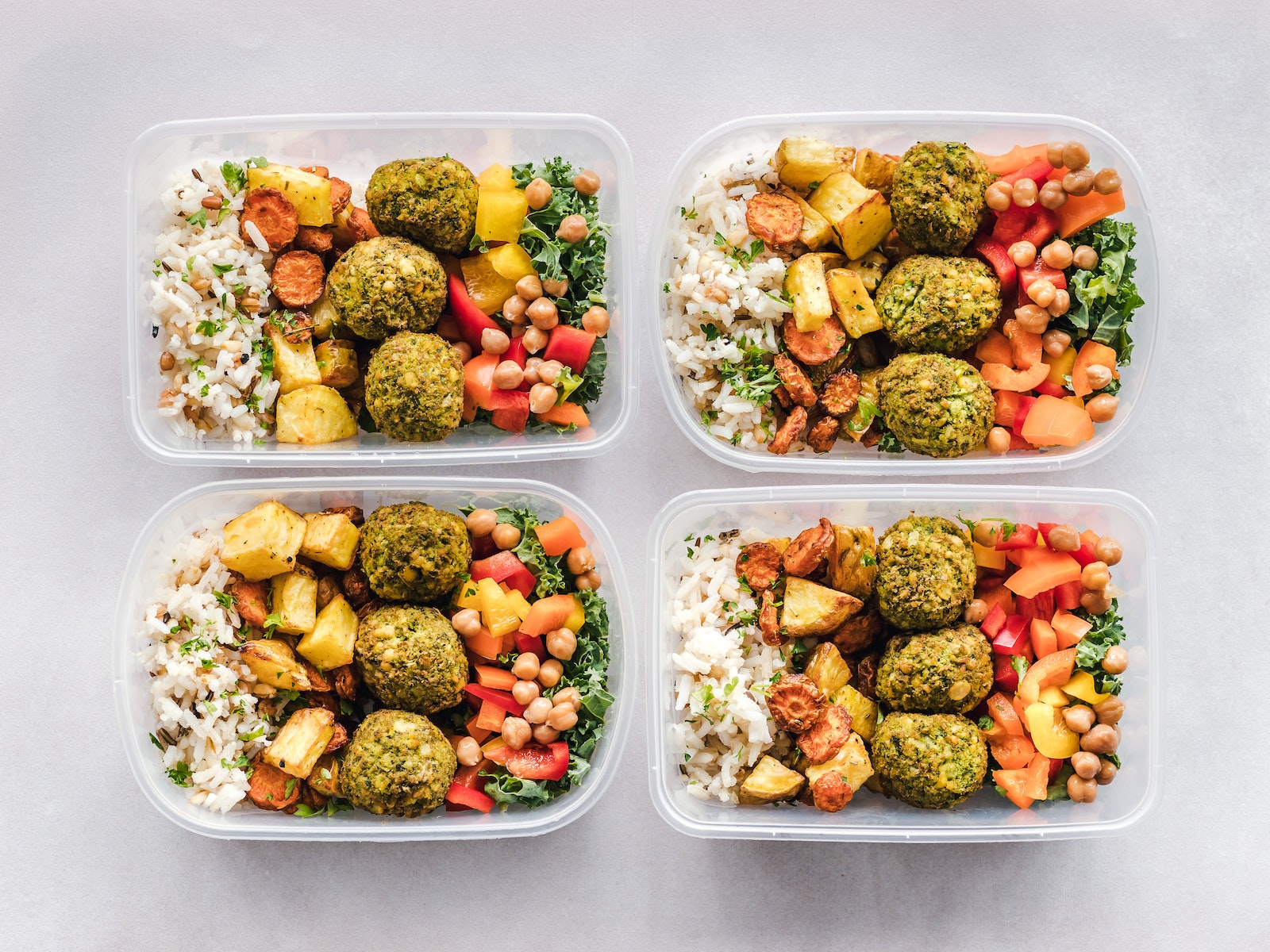 Meal prep bowls with falafel, veggies and carbs
