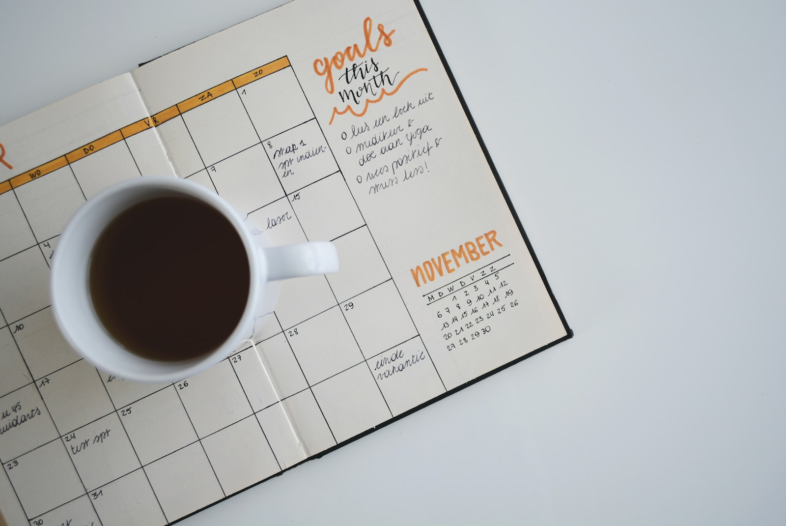 Calendar planner with coffee mug