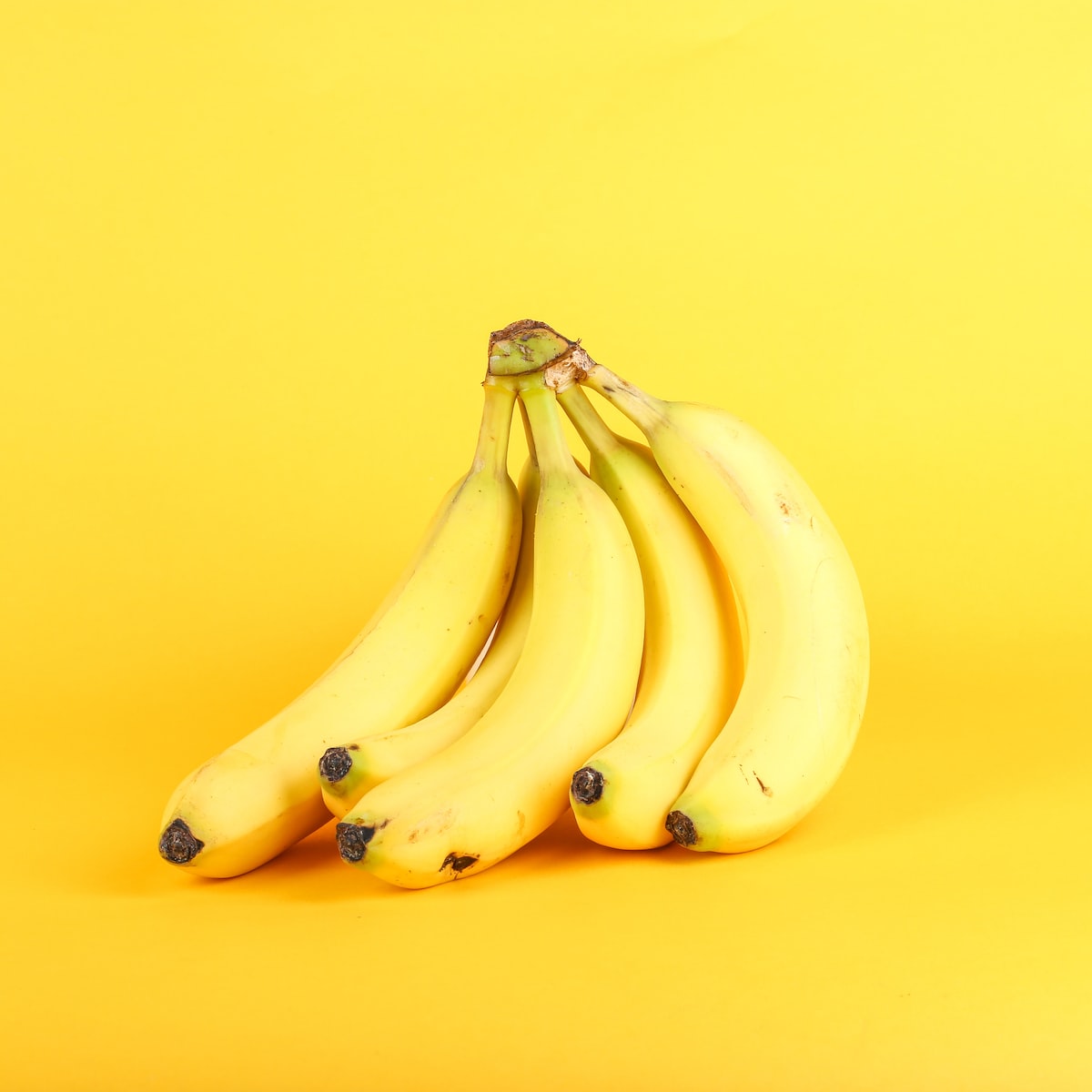 Bananas on yellow background
