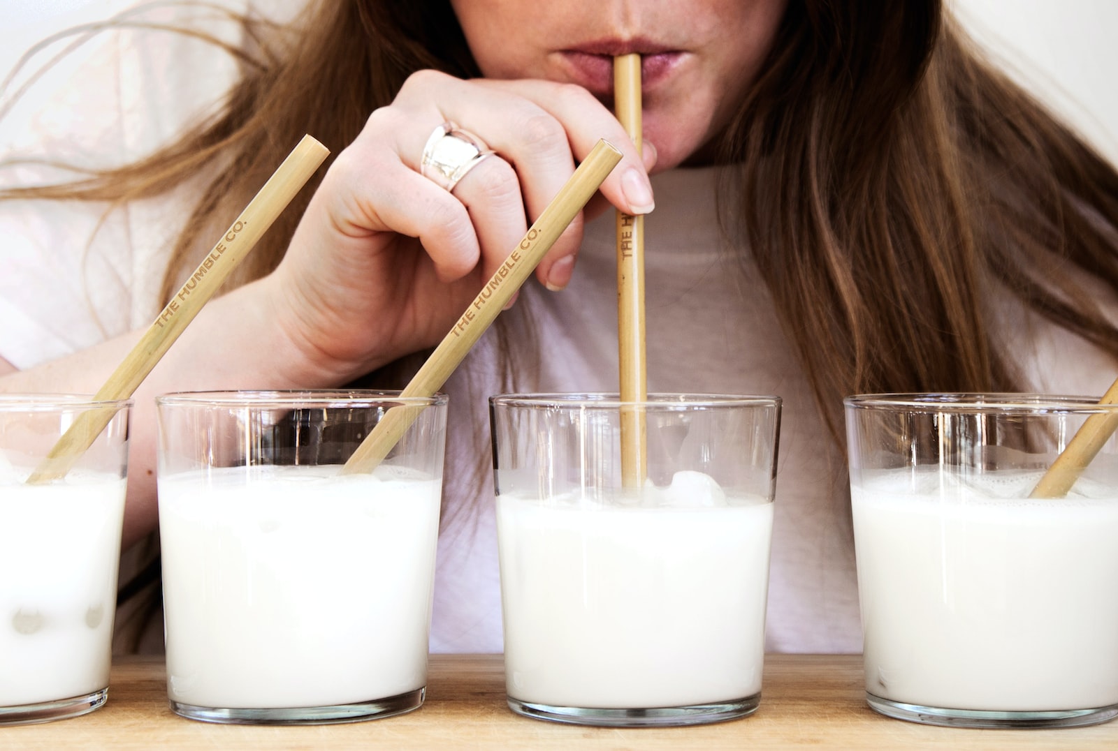 Girl drinking with paper straws