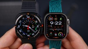 A person comparing two smart watches