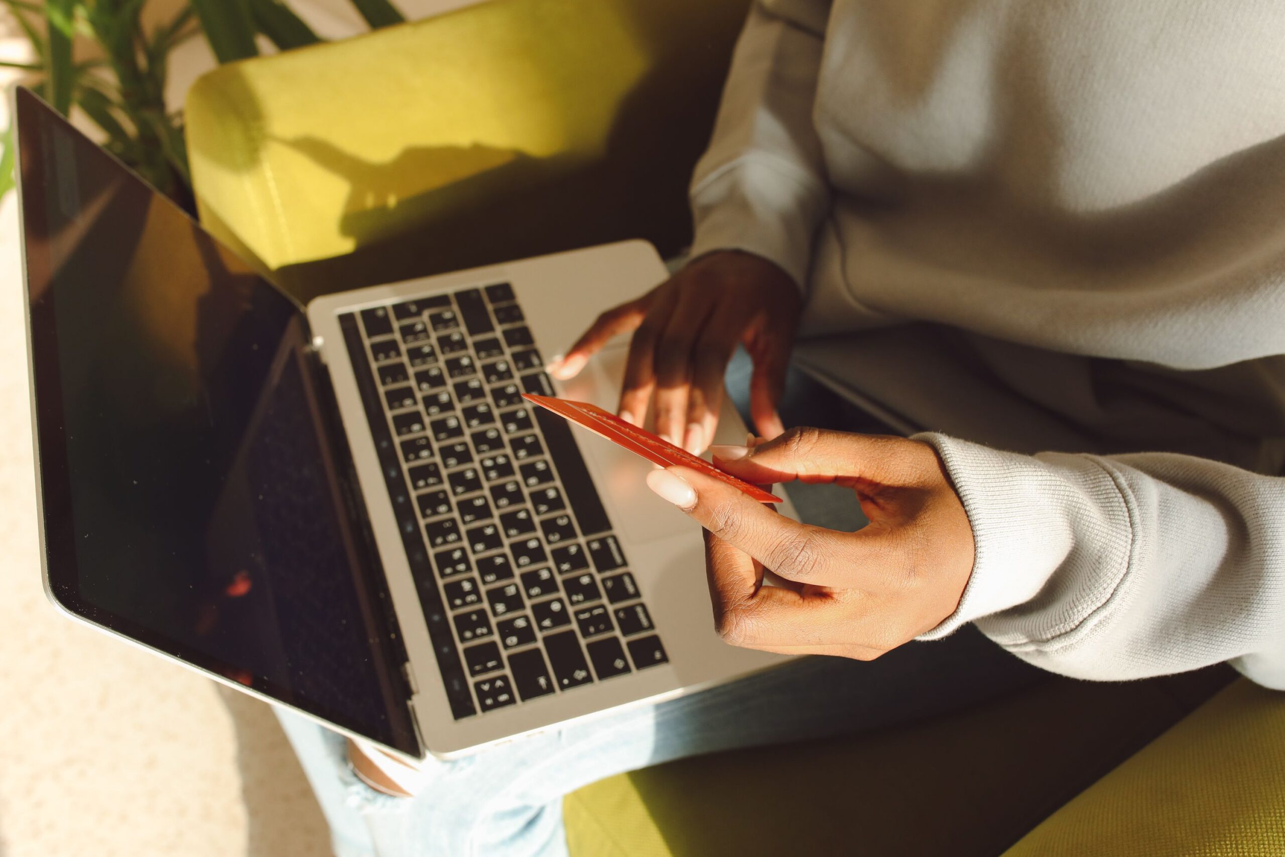 woman entering card details while shopping online